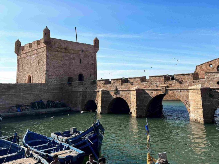 View of the port of Essaouira with its typical blue fishing boats, a symbol of Moroccan culture, View of the harbor of Essaouira with its typical blue fishing boats, a symbol of Moroccan culture.